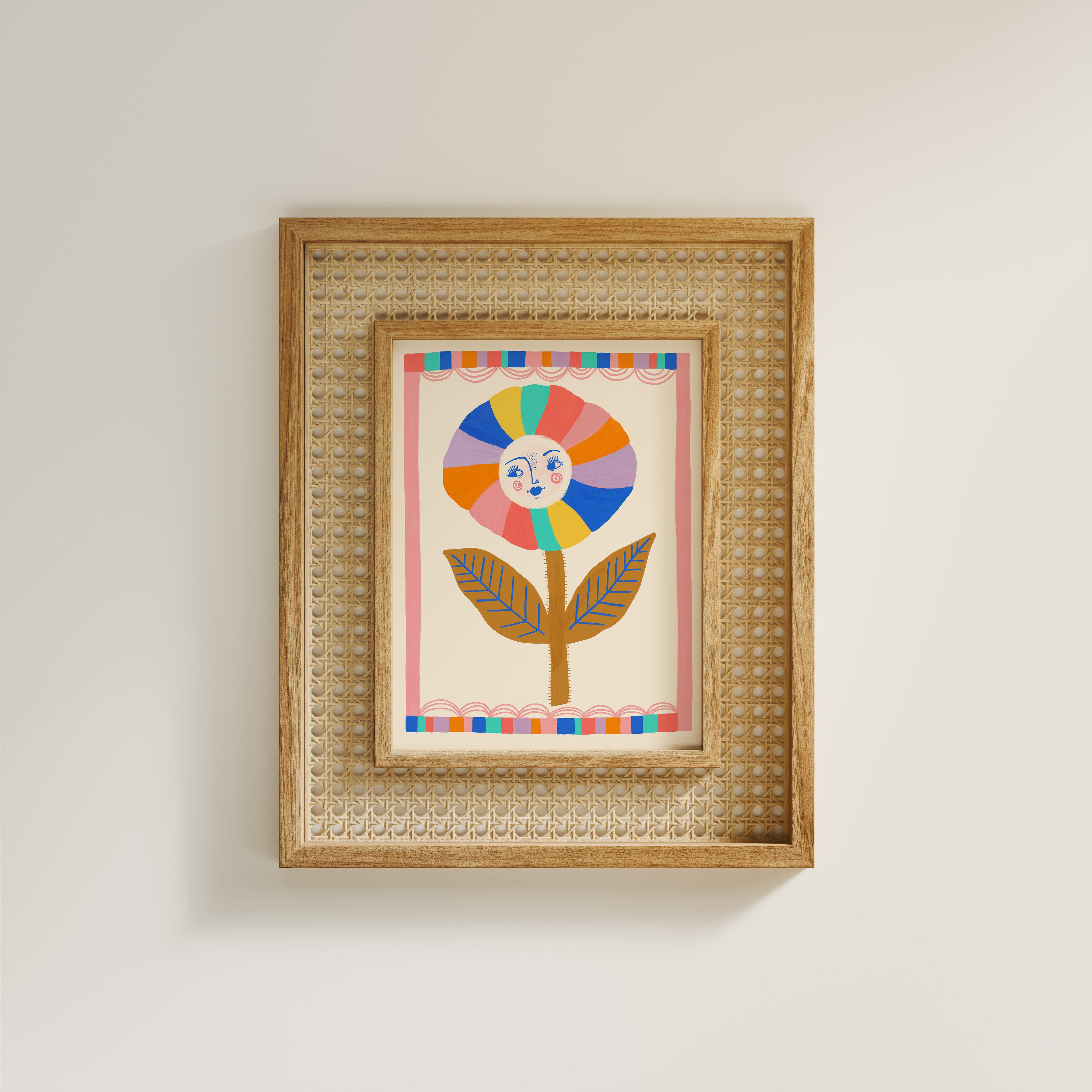 Framed artwork with a colorful flower design on a plain wall